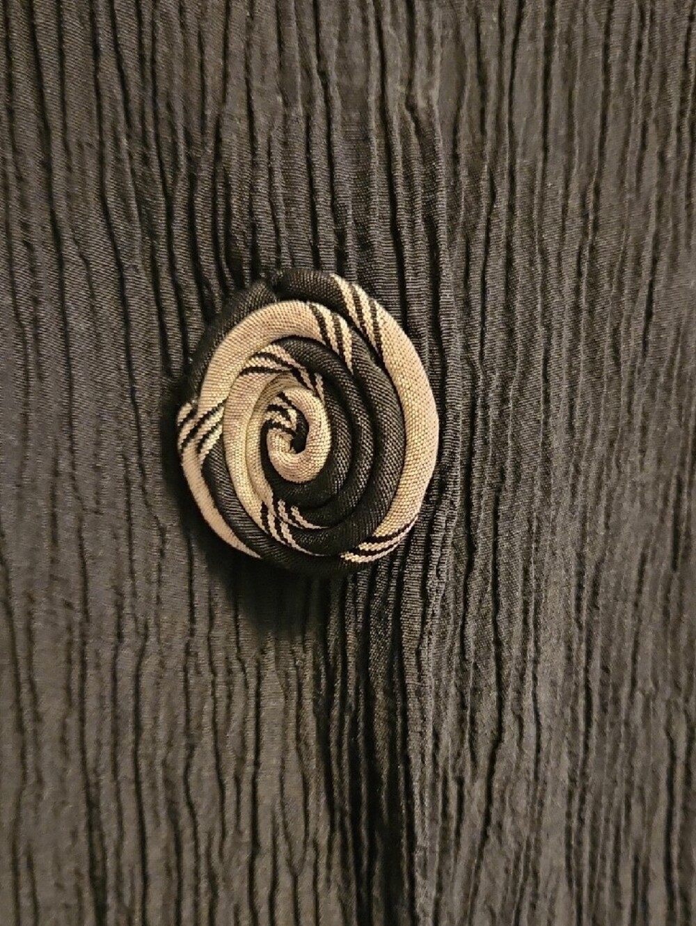 Black Crinkle Sleeveless V-Neck Vest with Decorative Large Unique Swirl Buttons - Picture 3 of 6